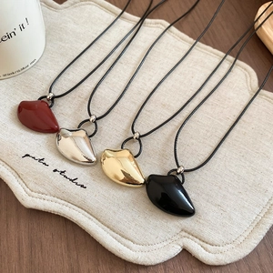 Irregular heart shaped pendant necklace set in burgundy silver gold and black colors