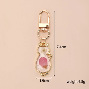 Cat-shaped resin keychain with pink dried flowers, showing 1.9x7.4cm size and 6.8g weight