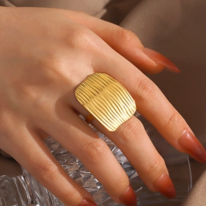 18K gold plated stainless steel rectangle ring with wavy texture on woman's finger