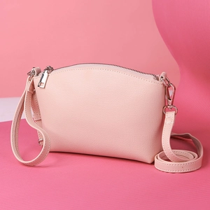 Pink lychee texture shoulder bag with silver hardware and a minimalist design