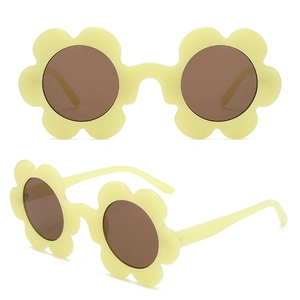 Detail of yellow flower-shaped sunglasses with brown lenses from front and side angles
