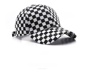 Detail of adjustable strap and canvas texture on a black and white checkerboard baseball cap
