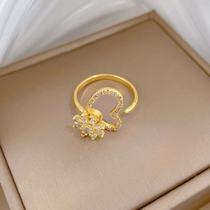 Adjustable gold plated open ring with heart frame and starburst zircon cluster