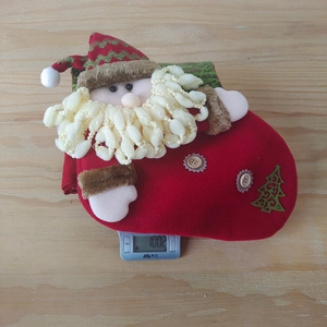 Christmas stocking gift bag weight display showing Santa Claus and tree decor