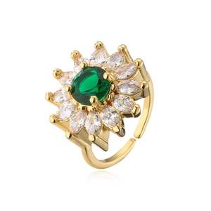Macro detail of 18K gold plated sunflower ring with green zircon and white crystals