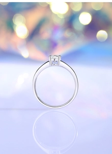 Macro shot of 0.5ct Moissanite diamond ring with four-claw setting on silver band