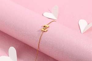Detailed macro of golden letter Z pendant set with small diamonds on a fine chain