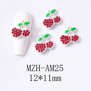 Detail of red rhinestone cherry nail art charms with dimensions 12x11mm on white tip