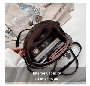 Interior view of the vintage shell bag showing main compartment and storage capacity