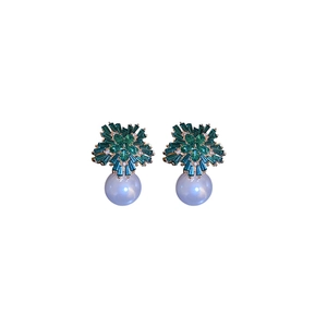 Elegant gold earrings with green rhinestone flowers and pearl drops on a white background