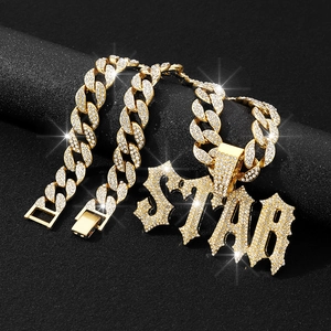 Close-up of golden Cuban chain with STAR letter pendant and sparkling rhinestones
