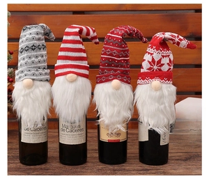Set of 4 Christmas gnome wine bottle covers with knitted hats and white faux fur beards