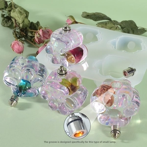Detailed view of cat paw resin mold with LED light slot and floral resin craft