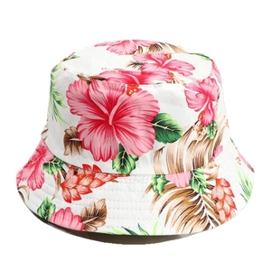 Reversible bucket hat with pink hibiscus flowers and green tropical leaf prints