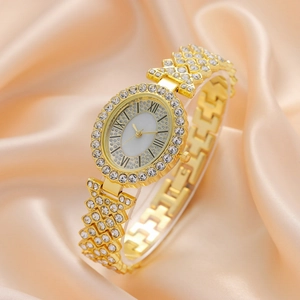 Elegant gold-tone women's watch featuring sparkling rhinestones and roman numerals dial