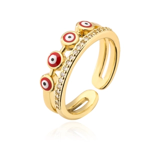 Detail view of gold adjustable ring featuring red evil eyes and sparkling white zircons