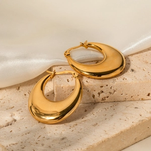 Polished 18K gold plated stainless steel chunky teardrop earrings on stone background