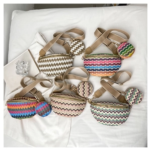 Close-up of woven waist bags with wave patterns and matching round coin purses