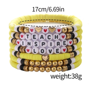 Detail of yellow beaded teacher bracelets set with TEACH INSPIRE LOVE letter beads