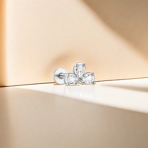 Macro shot of S925 silver flat back stud earring with three clear pear-shaped gemstones