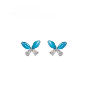 Detailed view of butterfly stud earrings featuring cat eye stone and clear zircon accents