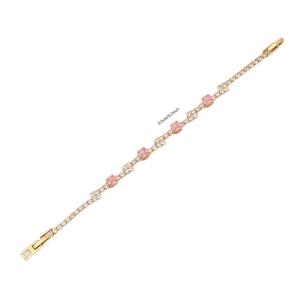 Elegant gold bracelet featuring pink square crystals and white zircons, width 0.5cm