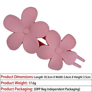 Detail view of pink matte flower hair claw clip with dimensions 10.3cm x 5.6cm