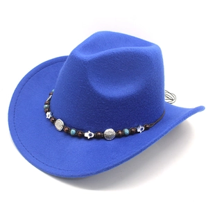 Detail of bright blue western cowboy hat featuring ethnic beaded band and turquoise accents