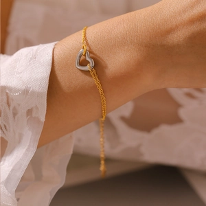 French style hollow heart bracelet in 18k gold plated stainless steel on wrist