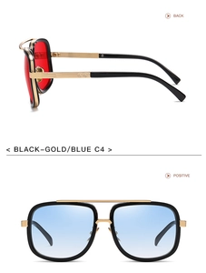 Detail of oversized metal pilot sunglasses with blue gradient lenses and textured gold frames