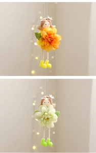 Detail of fabric flower fairy ornaments with colorful floral skirts for Easter party decor