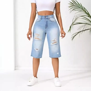 High waist light blue distressed denim shorts for women with ripped details on white background