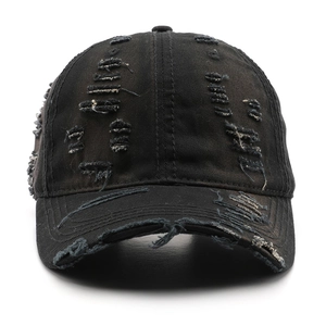Distressed black washed cotton baseball cap with ripped details and a vintage street look