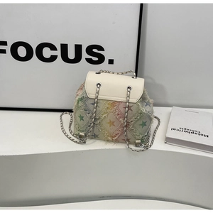 Detail of colorful tweed backpack with silver chain strap and white leather flap closure