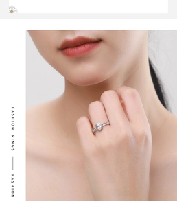 Close-up of S925 silver hollow chain ring featuring a brilliant oval-cut center gemstone