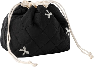 Detail of black quilted drawstring bag with white cross embroidery and cotton ropes