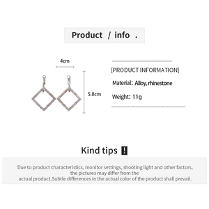 Detailed view of silver rhinestone diamond-shaped earrings with 4cm by 5.8cm dimensions