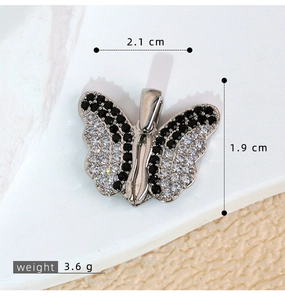 Detailed size view of silver butterfly pendant with black and white pavé cubic zirconia