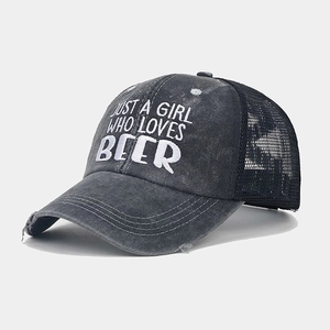 Detail of gray washed cotton trucker hat with mesh back and embroidered beer slogan