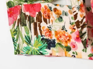 Close-up of vibrant floral print on soft chiffon fabric for elegant women midi dress