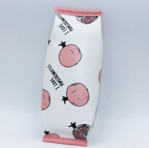 Detail of PU leather pencil case featuring pomegranate print and sturdy pink edge stitching