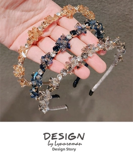 Macro detail of three handmade beaded crystal headbands in gold, blue and grey