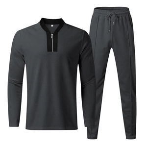 Detailed waffle texture of dark grey men's tracksuit set with quarter zipper and cuffs