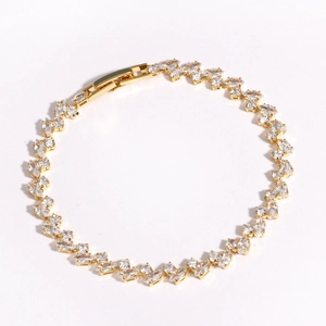 Close-up of golden marquise-cut cubic zirconia bracelet with detailed claw setting