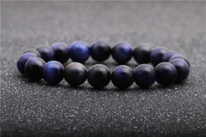 Macro shot of 8-10mm blue tiger eye stone beads bracelet with natural cat eye effect
