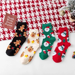 Christmas themed crew socks set featuring reindeer, Santa, and snowman patterns in four colors