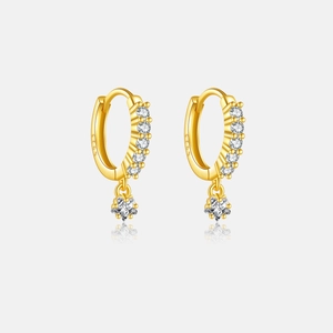 Detail of S925 sterling silver gold plated hoop earrings with white zircon star pendant