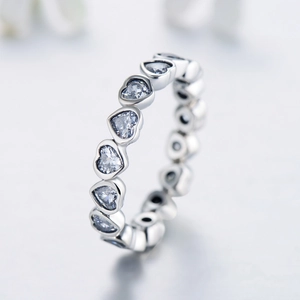 Elegant s925 silver eternity ring with heart-shaped crystals on a white background