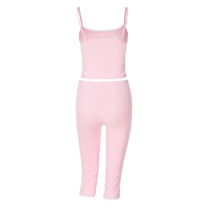 Detail of pink ribbed loungewear set featuring delicate lace trim on the camisole top