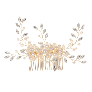 Detail of handmade bridal hair comb with ivory pearls and sparkling crystal floral accents